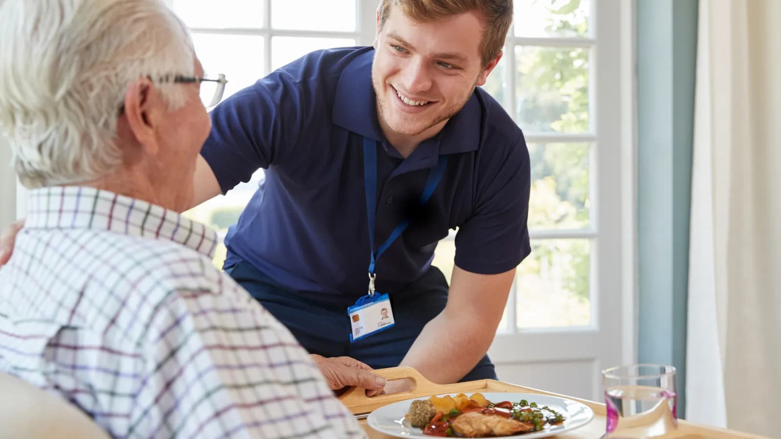 A caregiver supporting an older person