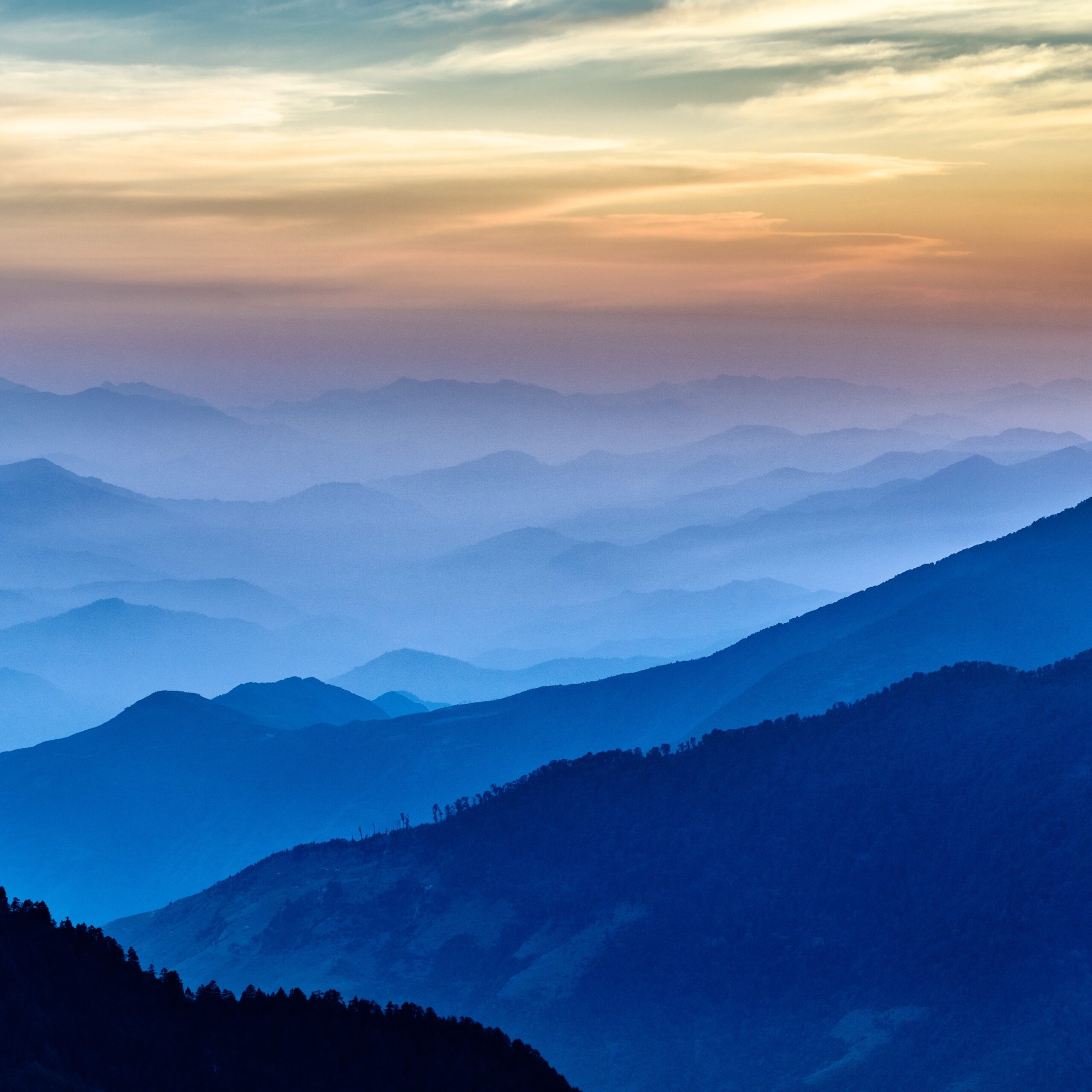 Blue mountains against sunset sky